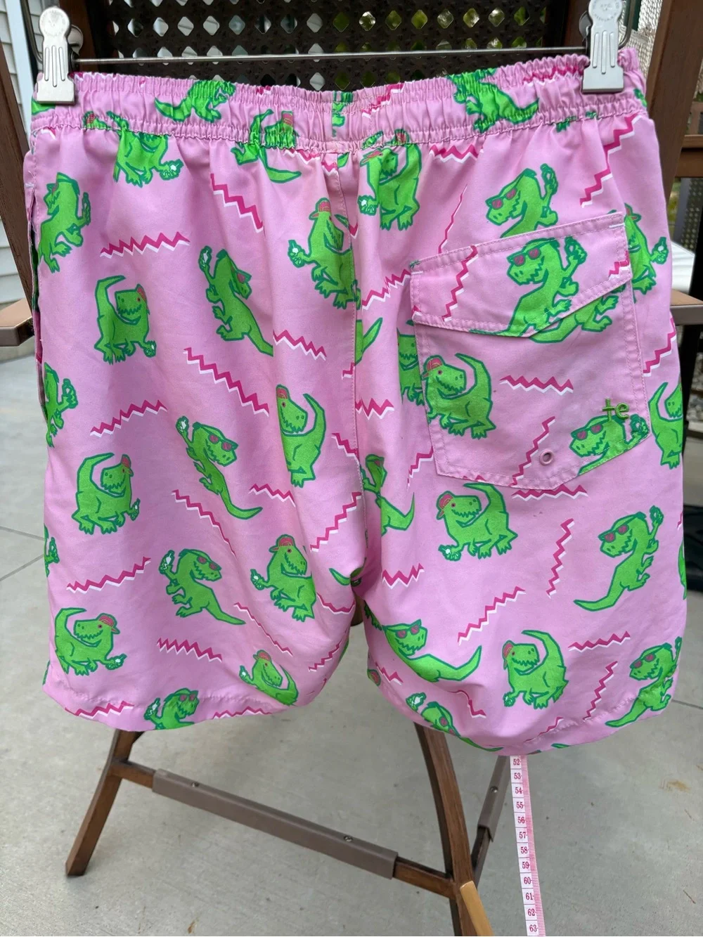 Tipsy Elves Men’s Pink Swim Shorts with Green Dinosaur Print- size M